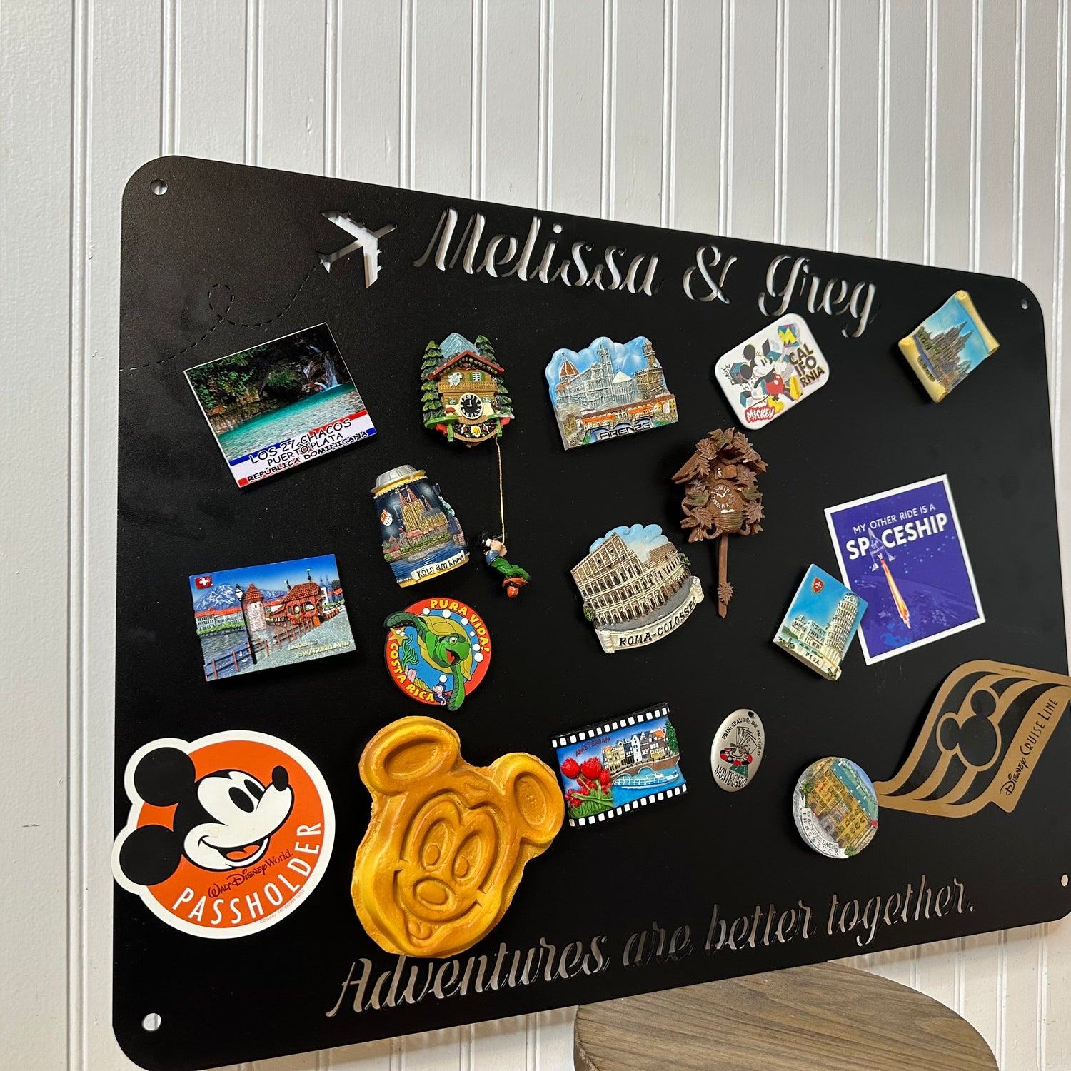Travel Magnet Display Board  that is personalized and displaying a variety of travel magnets