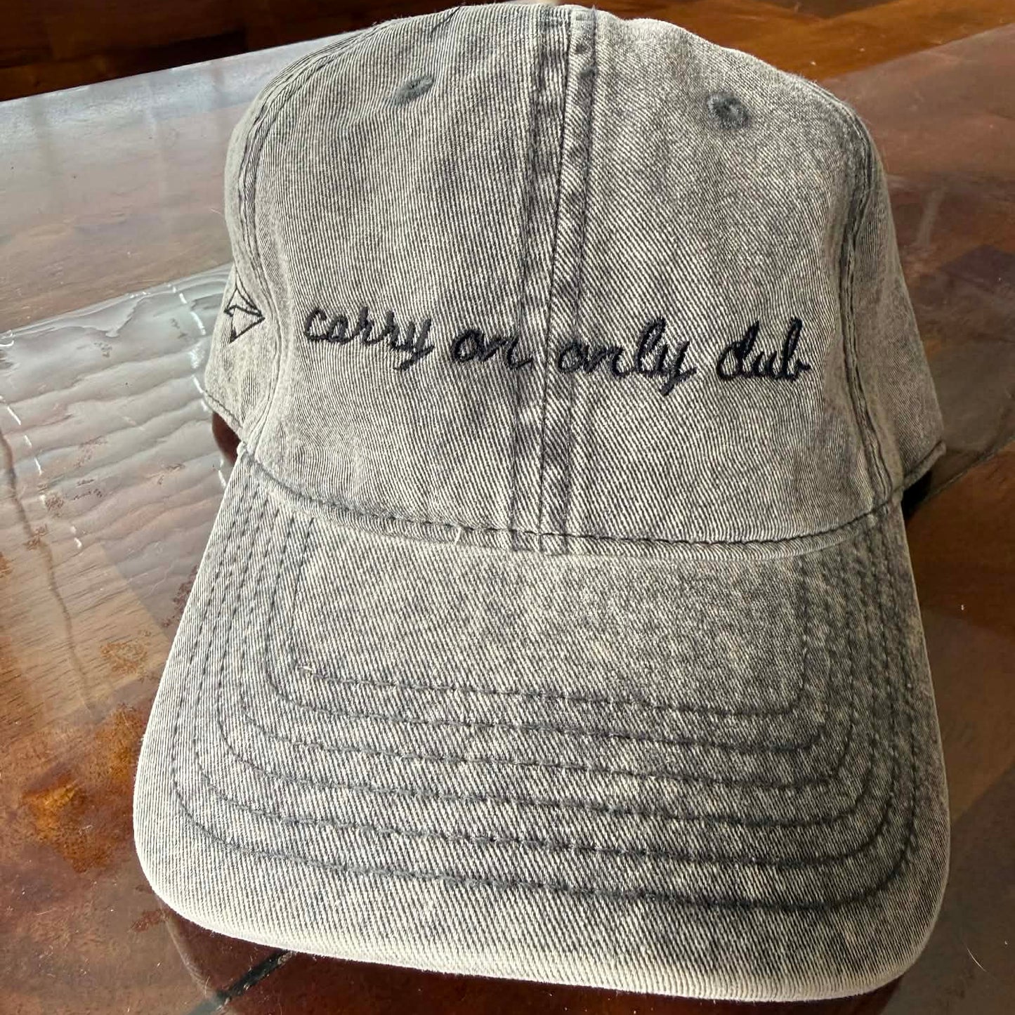 "Carry On Only Club" Funny Hat for Travel Lovers on table