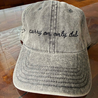 "Carry On Only Club" Funny Hat for Travel Lovers on table