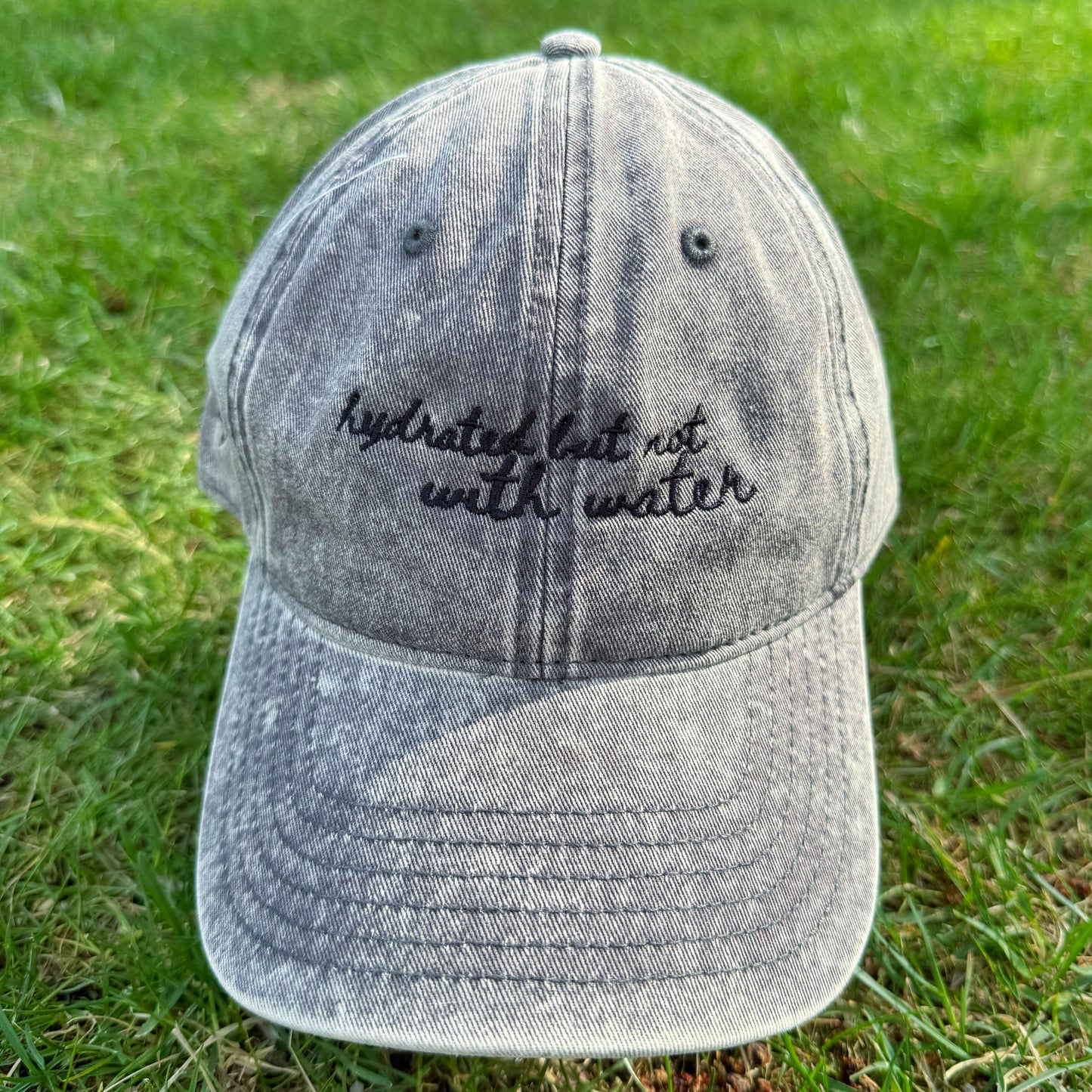 "Hydrated but not with water" - Funny Travel Hat for Beach Lovers-  on grass