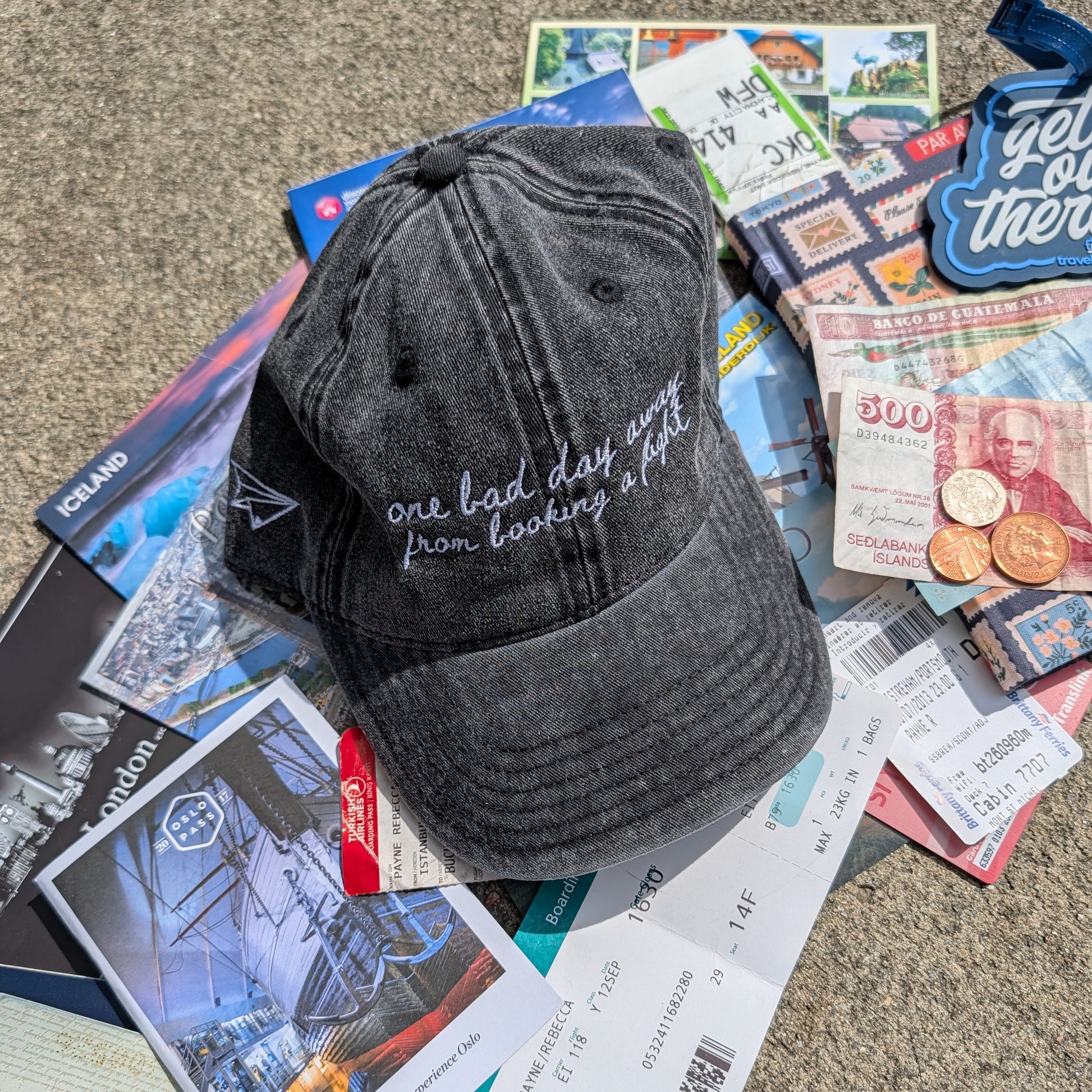 "One bad day away from booking a flight" Funny hat for travel lovers - flatlay