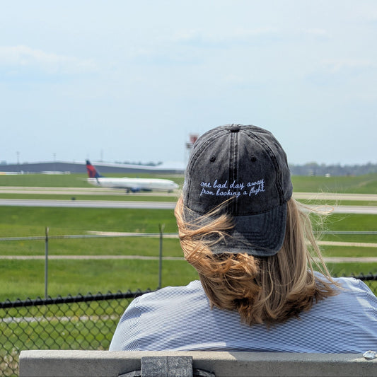 "One bad day away from booking a flight" Funny hat for travel lovers - on someone watching planes