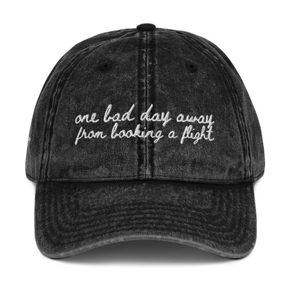 "One bad day away from booking a flight" Funny hat for travel lovers - mock up